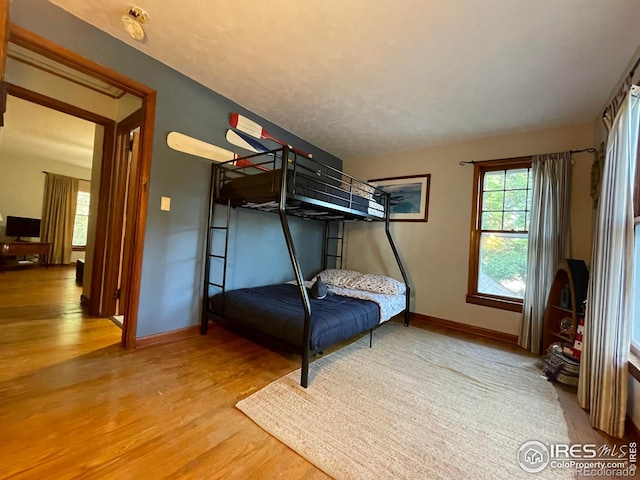 unfurnished bedroom featuring hardwood / wood-style flooring