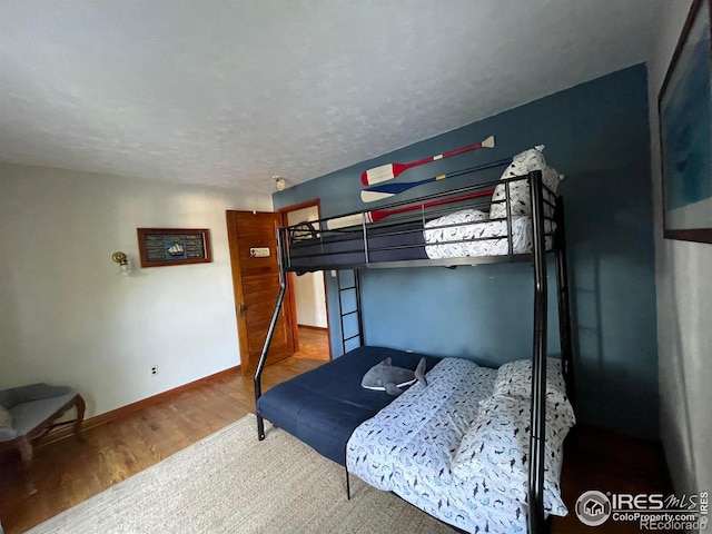 bedroom featuring hardwood / wood-style flooring