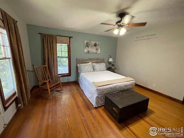 bedroom featuring hardwood / wood-style flooring and ceiling fan