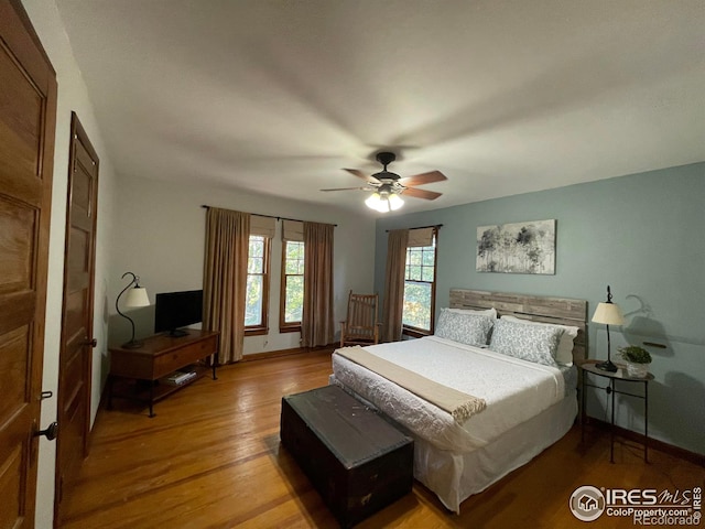 bedroom featuring ceiling fan and light hardwood / wood-style flooring