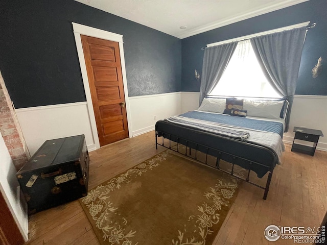 bedroom featuring hardwood / wood-style flooring