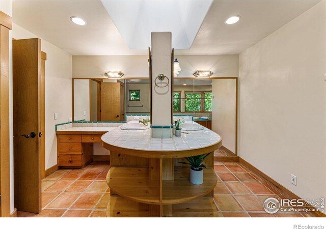 bathroom with vanity and tile patterned floors