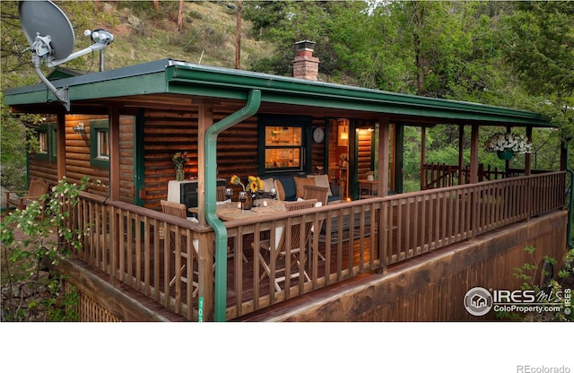 deck featuring outdoor lounge area