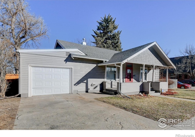 ranch-style home with covered porch and a garage