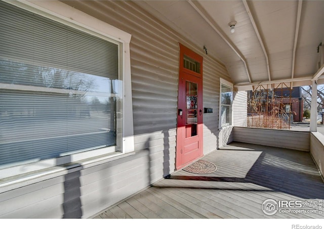 doorway to property featuring a porch