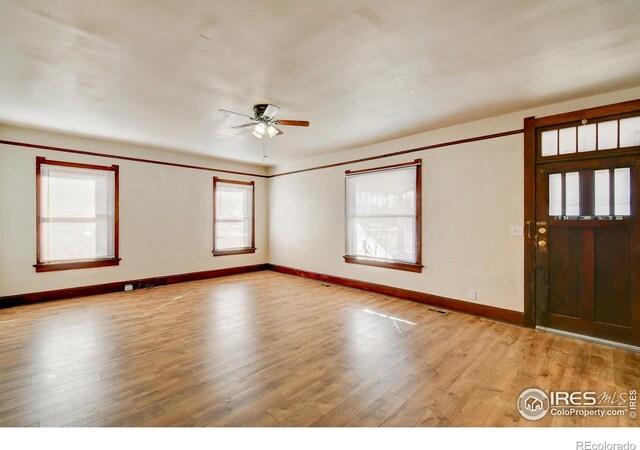 interior space featuring ceiling fan and light wood-type flooring