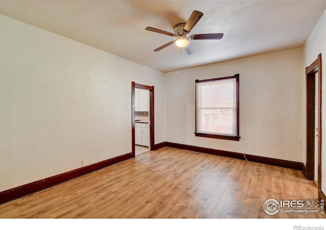 spare room with ceiling fan and light hardwood / wood-style floors