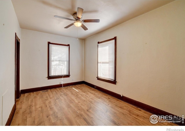 unfurnished room featuring light hardwood / wood-style flooring, a healthy amount of sunlight, and ceiling fan