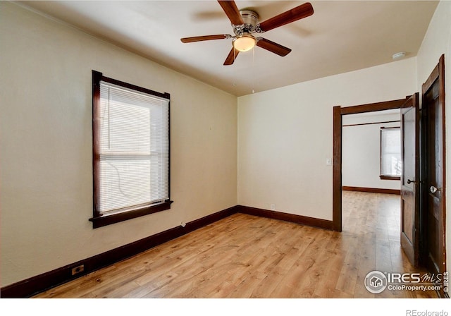 spare room featuring ceiling fan and light hardwood / wood-style flooring