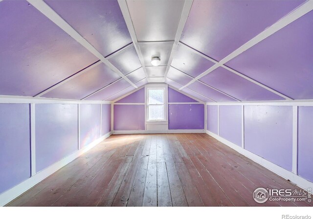 bonus room featuring hardwood / wood-style floors and vaulted ceiling