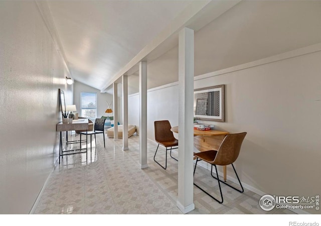 dining space featuring lofted ceiling