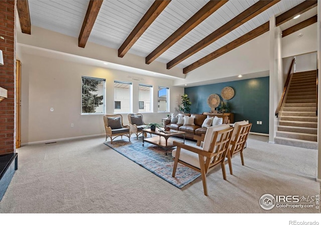 living room with beam ceiling, high vaulted ceiling, and light carpet