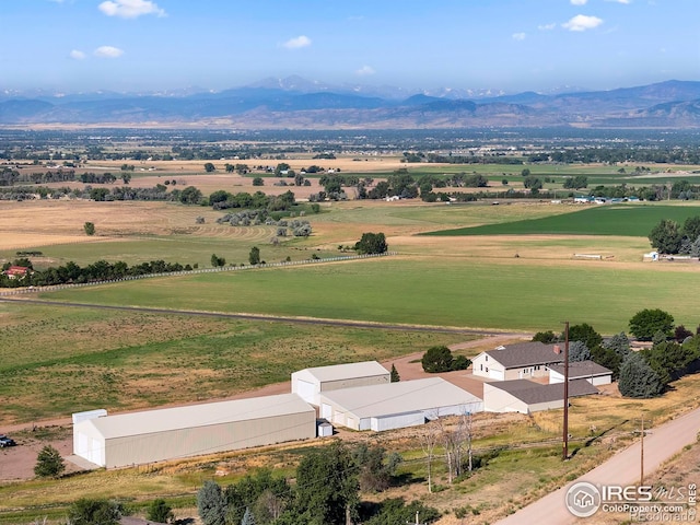 birds eye view of property with a mountain view and a rural view