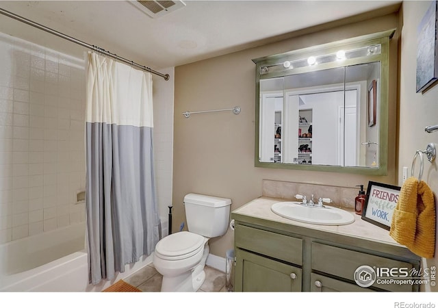 full bathroom with tile floors, toilet, oversized vanity, and shower / bath combo with shower curtain