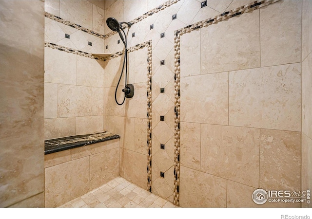 bathroom featuring tiled shower