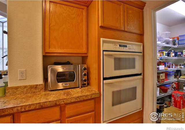 kitchen featuring white double oven