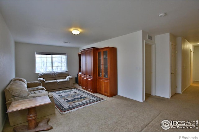 living room featuring light carpet