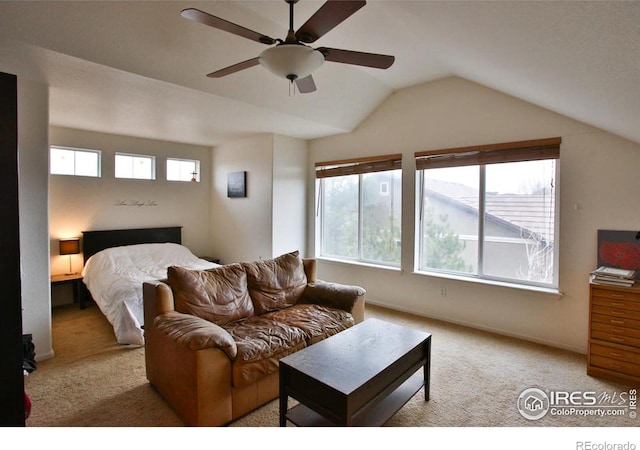 carpeted bedroom featuring multiple windows, vaulted ceiling, and ceiling fan