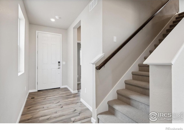 foyer entrance featuring light hardwood / wood-style flooring