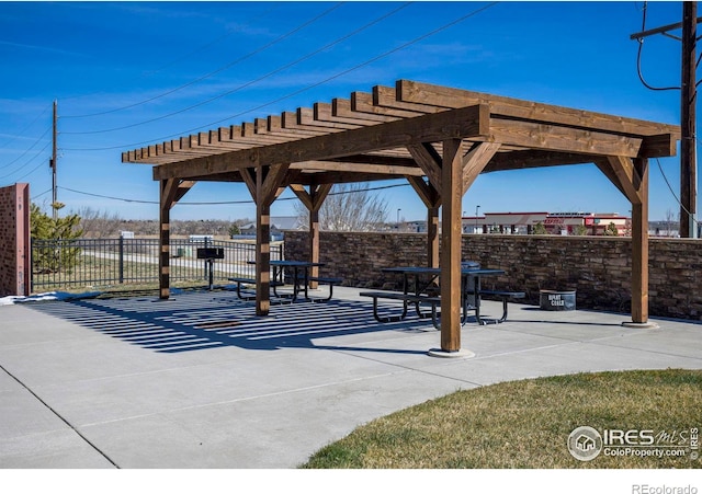 view of home's community with a pergola and a patio area