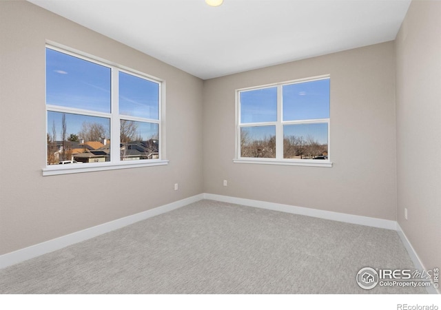 unfurnished room with carpet floors