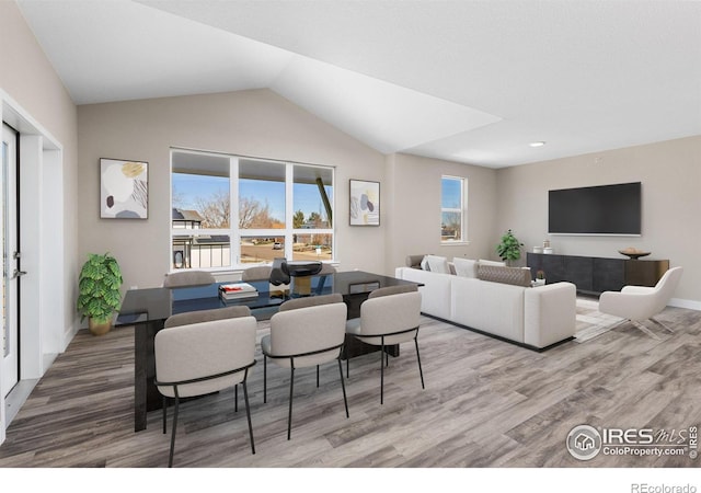 living room with lofted ceiling and hardwood / wood-style flooring