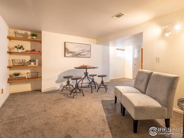 sitting room with carpet flooring