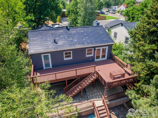 back of property featuring a deck