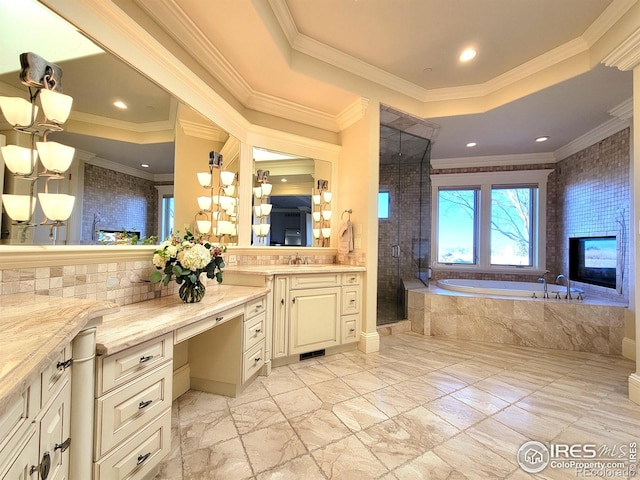 bathroom featuring independent shower and bath, tile patterned flooring, vanity, a raised ceiling, and crown molding