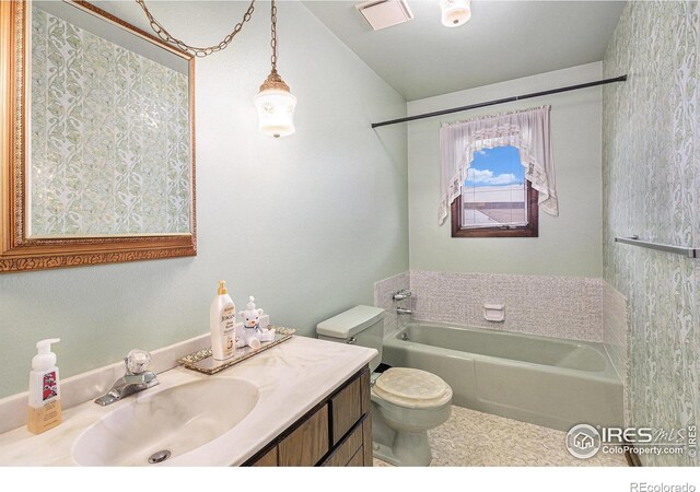 bathroom with toilet and vanity