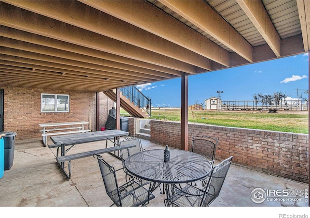 view of terrace featuring a storage shed