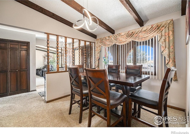 carpeted dining room featuring an inviting chandelier, lofted ceiling with beams, and a textured ceiling