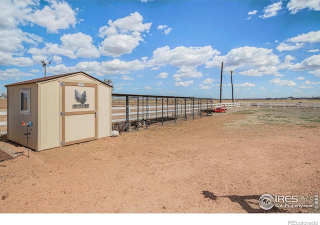 view of outdoor structure featuring a rural view