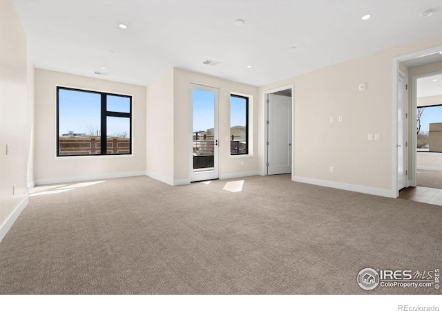 view of carpeted spare room