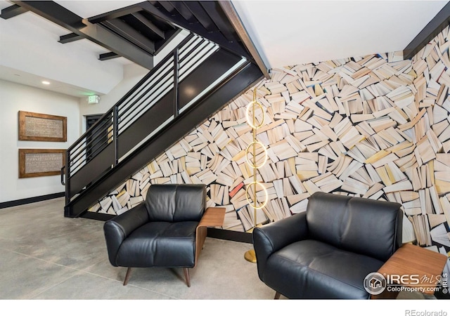 sitting room featuring concrete floors