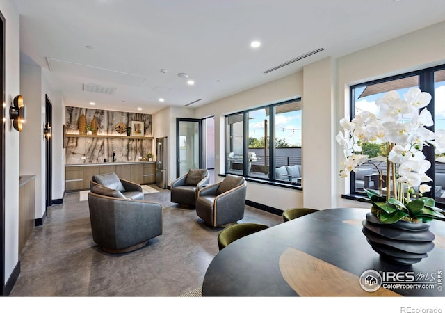 living room featuring concrete flooring