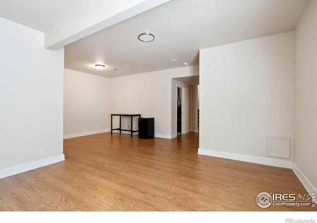 spare room with light hardwood / wood-style floors