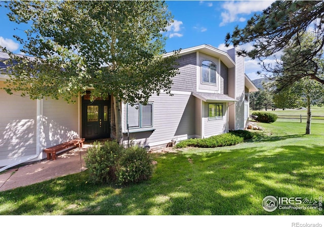 view of front of home with a front yard