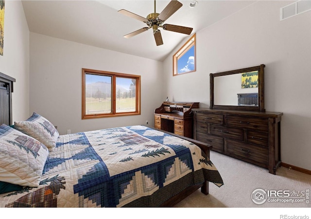 bedroom with light colored carpet, ceiling fan, and vaulted ceiling