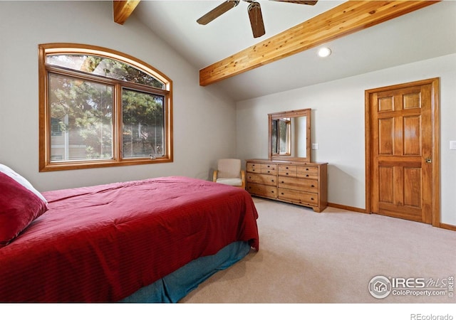 carpeted bedroom featuring lofted ceiling with beams and ceiling fan