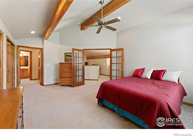 bedroom featuring lofted ceiling with beams, ensuite bathroom, french doors, light colored carpet, and ceiling fan