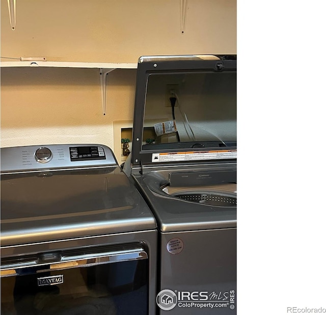 laundry area with washer and dryer and hookup for a washing machine