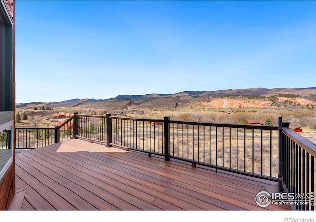 wooden terrace with a mountain view