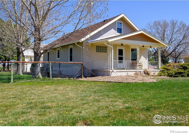 view of front of home featuring a porch and a front yard