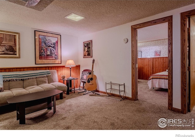 living room with carpet floors and a textured ceiling