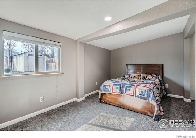 carpeted bedroom featuring lofted ceiling