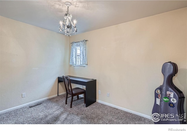 office area with carpet flooring and an inviting chandelier