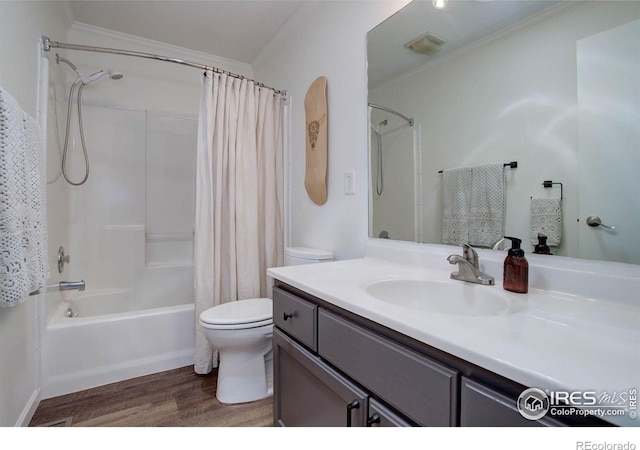 1553 Rowell Dr, Lyons, CO 80540 - full bathroom with wood finished floors, ornamental molding, vanity, toilet, and shower / bath combo