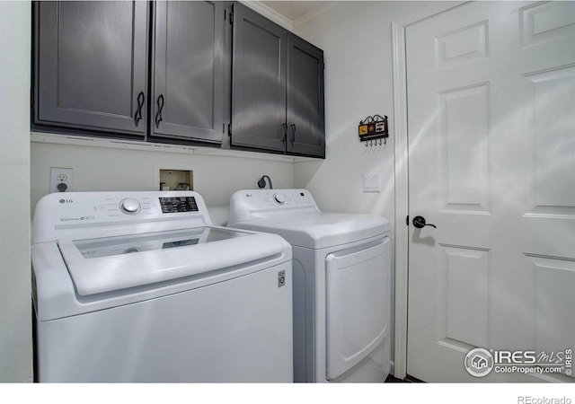 1553 Rowell Dr, Lyons, CO 80540 - laundry room with separate washer and dryer, cabinet space, and crown molding