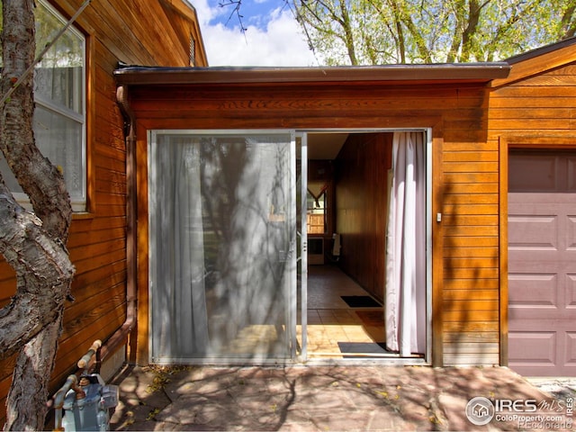 property entrance featuring a garage